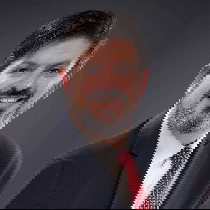 Demetrios L. Kouzoukas Logo